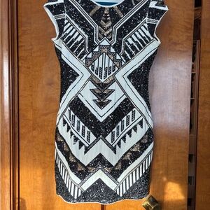 Express form fitting Black and White Geometric Mini Dress.